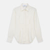 View 1 of product The Cream Silk Tailored Bianca Shirt by Turnbull & Asser features long sleeves, a pointed collar, and curved hem in soft-touch peace silk with a tailored fit. Shown laid flat on a white background.