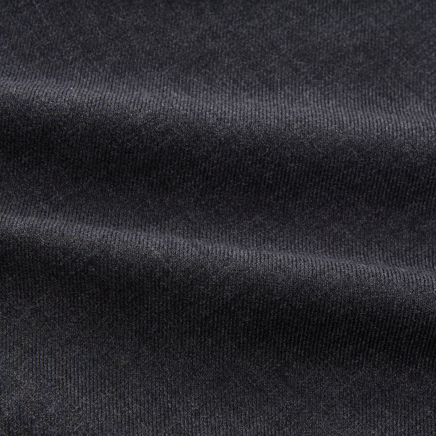 View 4 of product The Turnbull & Asser Charcoal Cotton Blend Weekend Fit Blake Shirt is a long-sleeve, stand-collar shirt with white buttons. Its minimalist design, with no pockets or patterns, makes it perfect for casual wear. Displayed flat on a white background.