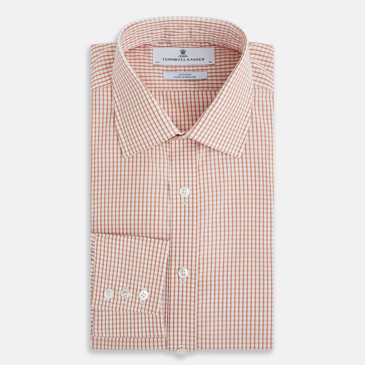 View 5 of product The Orange Micro Shadow Check Mayfair Shirt by Turnbull & Asser features a T&A collar, button-down front, and buttoned cuffs; crafted from Italian cotton in an orange and white check pattern, laid flat on a white background.