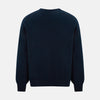 View 3 of product The Turnbull & Asser Navy Cashmere Round Neck Jumper for men is shown against a white background, featuring long sleeves, a relaxed fit, and ribbed cuffs, hem, and collar for an effortlessly elegant look.