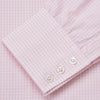 View 4 of product The Pink Windowpane Check Mayfair Shirt by Turnbull & Asser features a light pink, long-sleeve design with subtle windowpane checks, button-down front, and soft organic cotton, shown against a white background.