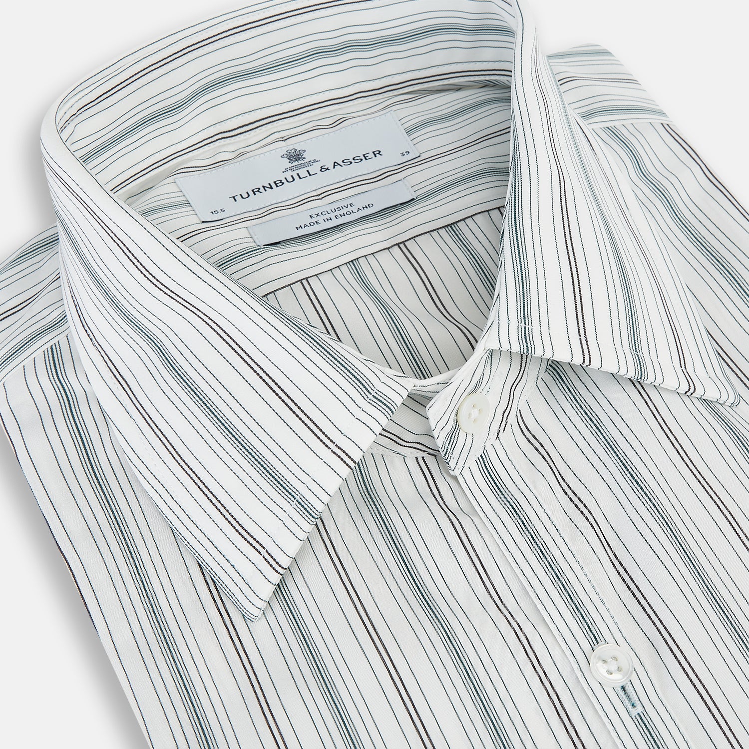 View 2 of product A Forest Green Multi Stripe Westminster Shirt by Turnbull & Asser, featuring thin green stripes on white and expert British craftsmanship, is neatly laid flat with visible cuffs.