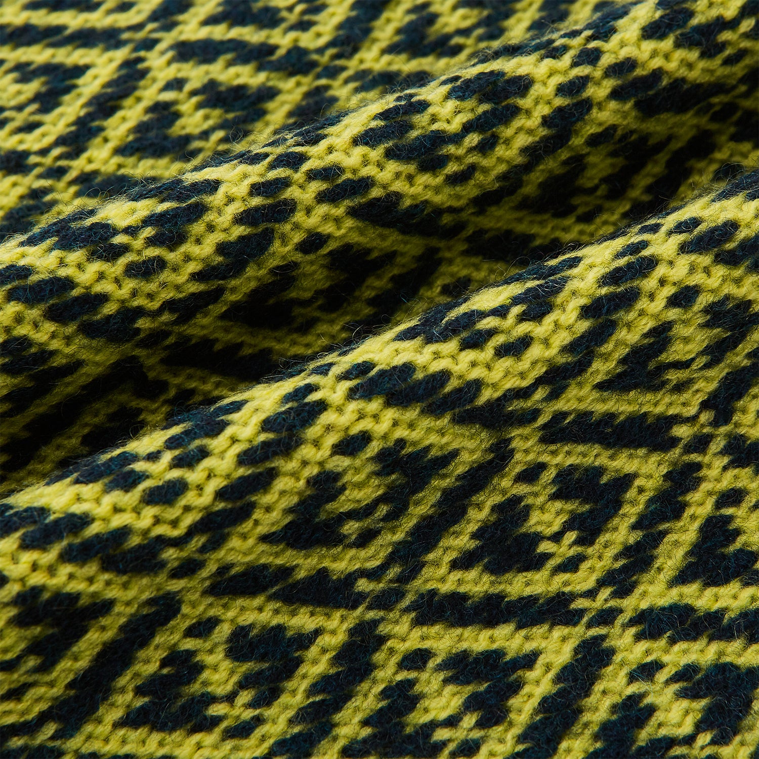 View 3 of product A Petrol Green and Chartreuse diamond-patterned cashmere knitted scarf by Turnbull & Asser—an essential accessory for adding striking geometric flair to any look.