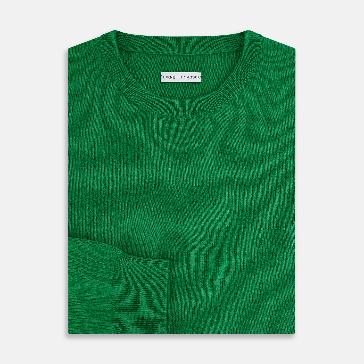 View 7 of product The Turnbull & Asser Grass Green Cashmere Round Neck Jumper features long sleeves, ribbed cuffs, collar, and hem, shown on a white background.