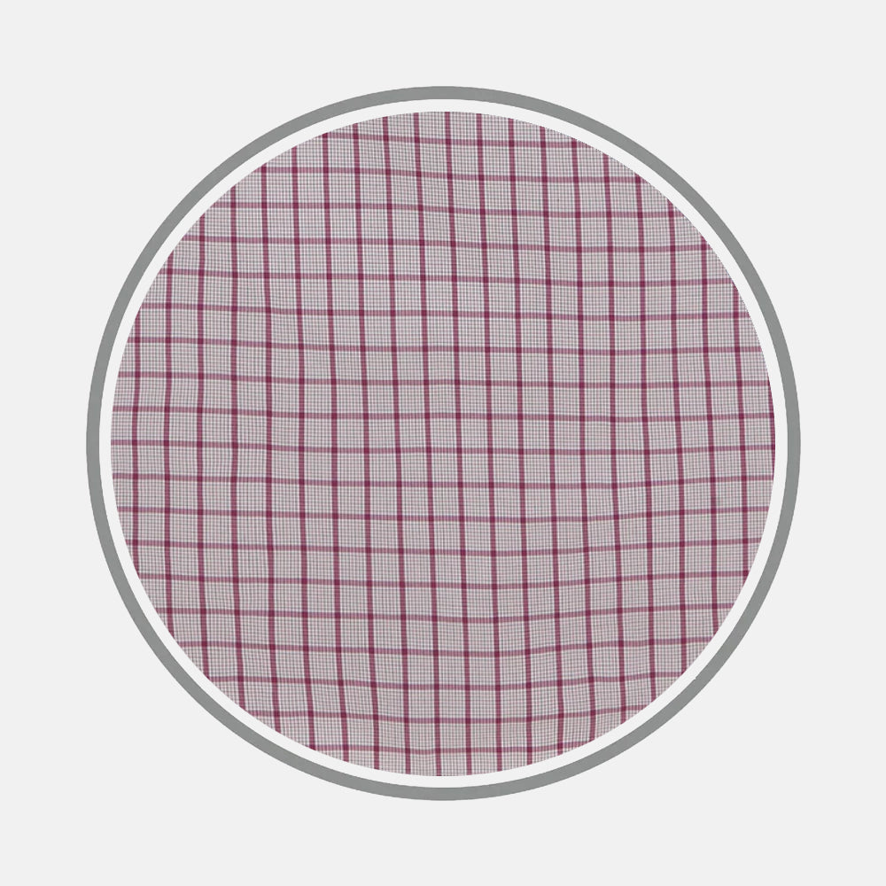 A round frame displays Turnbull & Asser’s Purple Graph Overlay Check Fabric, featuring a white base with a purple check pattern, set against a plain light gray background.