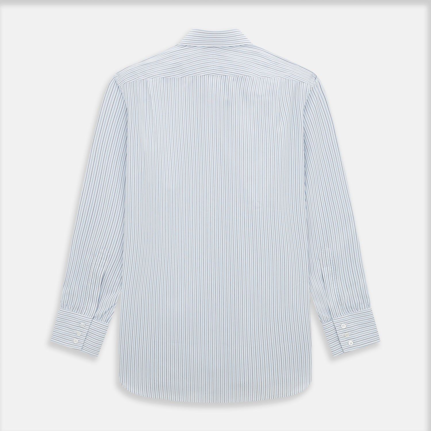 View 3 of product The Turnbull & Asser Navy and Blue Shadow Stripe Mayfair Shirt, featuring a classic T&A collar and buttoned cuffs, is laid flat on a white background.