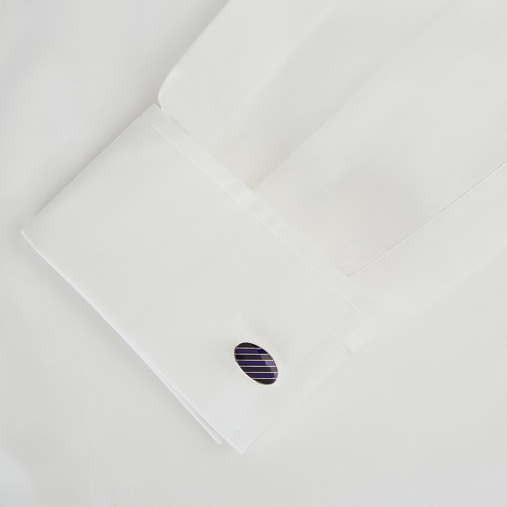 Turnbull & Asser Navy Striped Oval Enamel Cufflinks feature navy blue and black diagonal stripes, shiny silver edges, and a modern oval shape—reflecting masculine elegance in every detail.