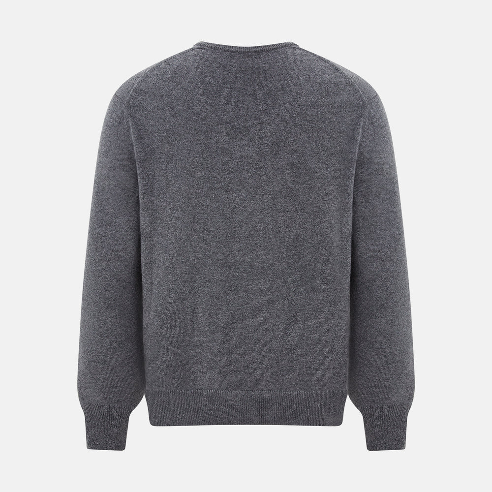 The Turnbull & Asser Storm Grey Cashmere V-neck Jumper features long sleeves, ribbed cuffs and hem—versatile knitwear shown on a white backdrop.