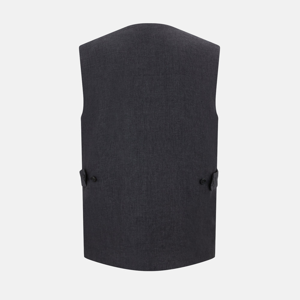 The Turnbull & Asser Ash Linen Twill Waistcoat is a dark gray, sleeveless V-neck with three front buttons, a chest pocket, and two diagonal zippered pockets in subtly textured twill. Shown on a plain white background.