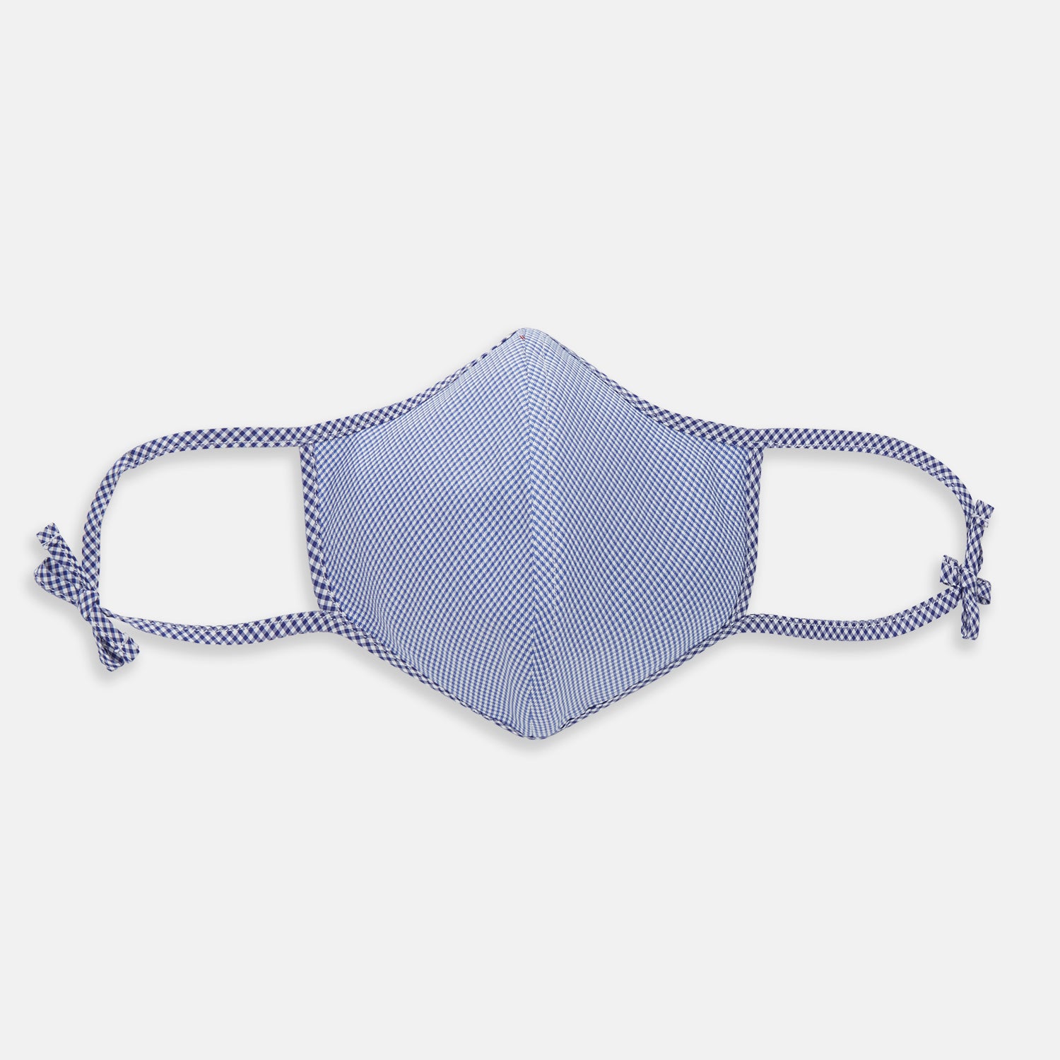 View 1 of product The Turnbull & Asser White & Navy Multi Check Commuter Mask comes with 3 Viroformula™ filters and two adjustable tie straps on each side, shown on a plain white background.