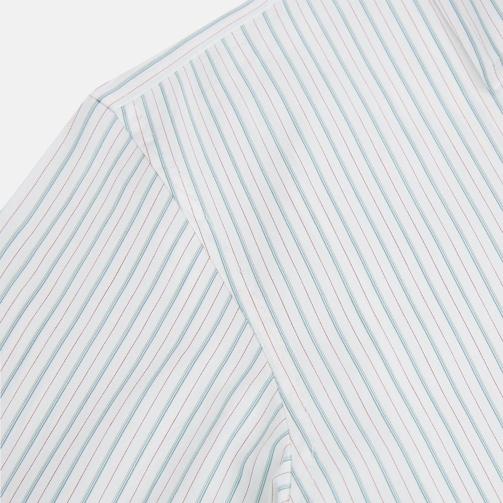 The Turnbull & Asser Turquoise and Red Multi Check Westminster shirt features long sleeves, a standard collar, and buttoned cuffs, showcasing fine British craftsmanship. It’s pictured laid flat on a white background.