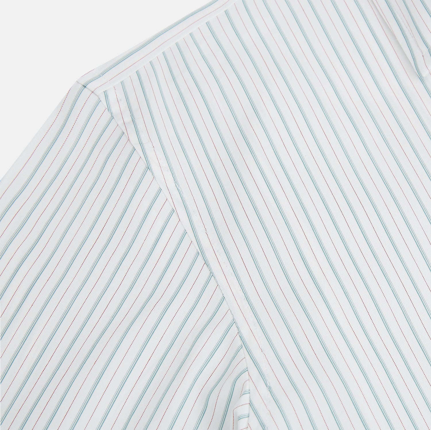 View 6 of product The Turnbull & Asser Turquoise and Red Multi Check Westminster shirt features long sleeves, a standard collar, and buttoned cuffs, showcasing fine British craftsmanship. It’s pictured laid flat on a white background.