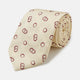 The Yellow Geometric Rings Silk Tie by Turnbull & Asser features a cream silk base with yellow geometric patterns and maroon rings, is hand-finished in England, and is shown rolled up on a white background.