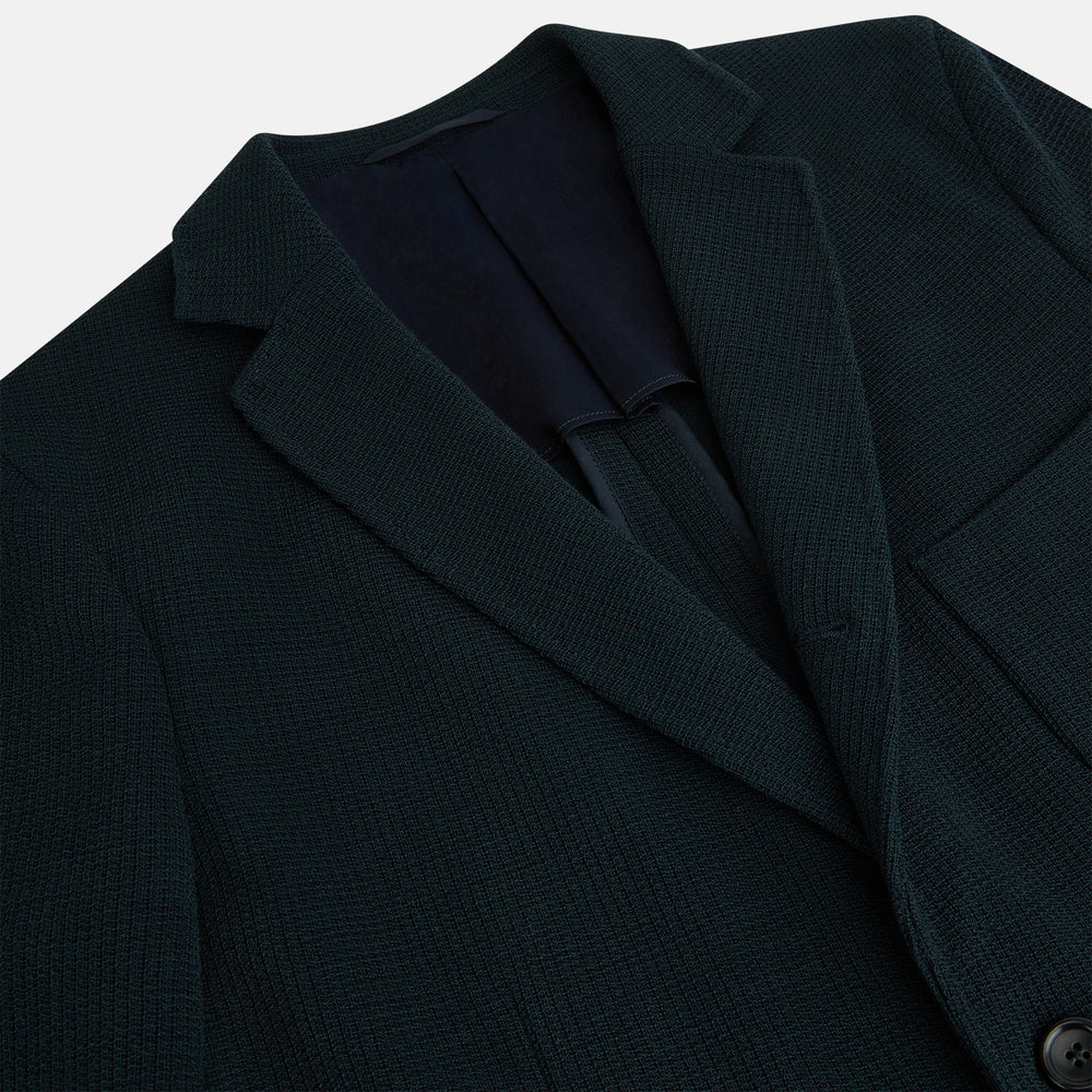 The Forest Green KNITTED CAMBRIDGE BLAZER by Turnbull & Asser, crafted from textured Italian wool with notch lapels, patch and chest pockets, and two buttons, is shown against a plain white background.