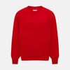 View 1 of product The Turnbull & Asser Red Merino Round Neck Jumper features long sleeves, ribbed cuffs and hem—a classic men's knitwear essential shown on a white background.