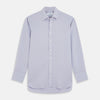 View 1 of product The Turnbull & Asser Lilac Silk Regular Fit Flaxton Shirt features long sleeves, a classic collar, white buttons, and a curved hem, shown laid flat on a white background.