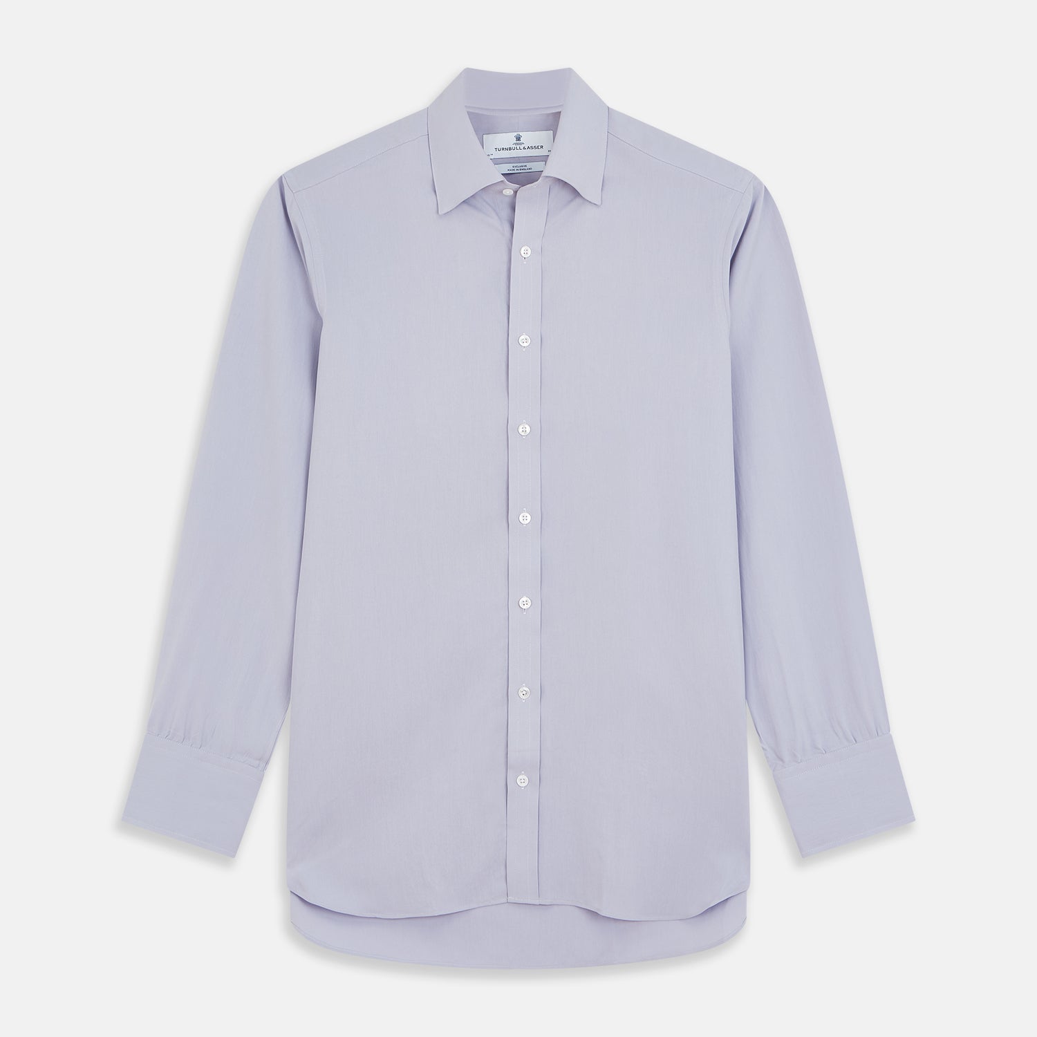 View 1 of product The Turnbull & Asser Lilac Silk Regular Fit Flaxton Shirt features long sleeves, a classic collar, white buttons, and a curved hem, shown laid flat on a white background.