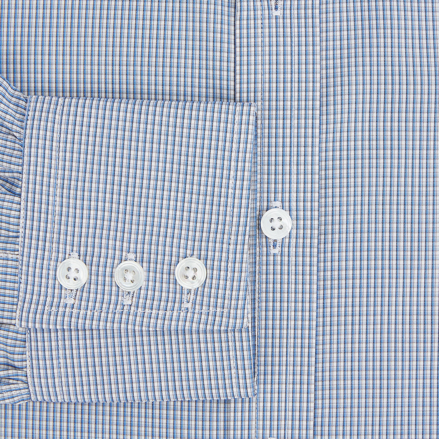 View 4 of product The Turnbull & Asser Pale Blue Micro Graph Check Mayfair Shirt features a small blue and white check pattern, classic T&A collar, white buttons, and buttoned cuffs. Presented on a plain white background.