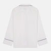 View 7 of product The Turnbull & Asser Women's Harriet Plain White Cotton Pyjama Set features long sleeves, black piping, a chest pocket, and matching pants with elastic waistband and ribbon tie, all displayed on a white background.