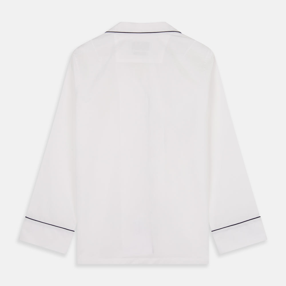 The Turnbull & Asser Women's Harriet Plain White Cotton Pyjama Set features long sleeves, black piping, a chest pocket, and matching pants with elastic waistband and ribbon tie, all displayed on a white background.