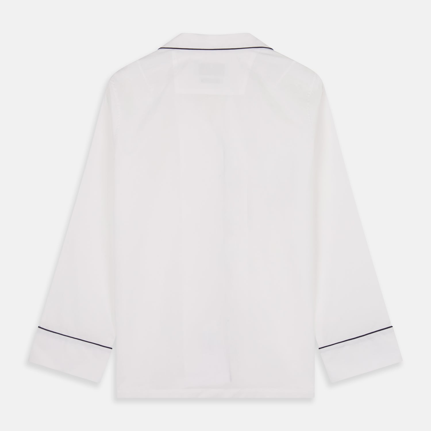 View 7 of product The Turnbull & Asser Women's Harriet Plain White Cotton Pyjama Set features long sleeves, black piping, a chest pocket, and matching pants with elastic waistband and ribbon tie, all displayed on a white background.