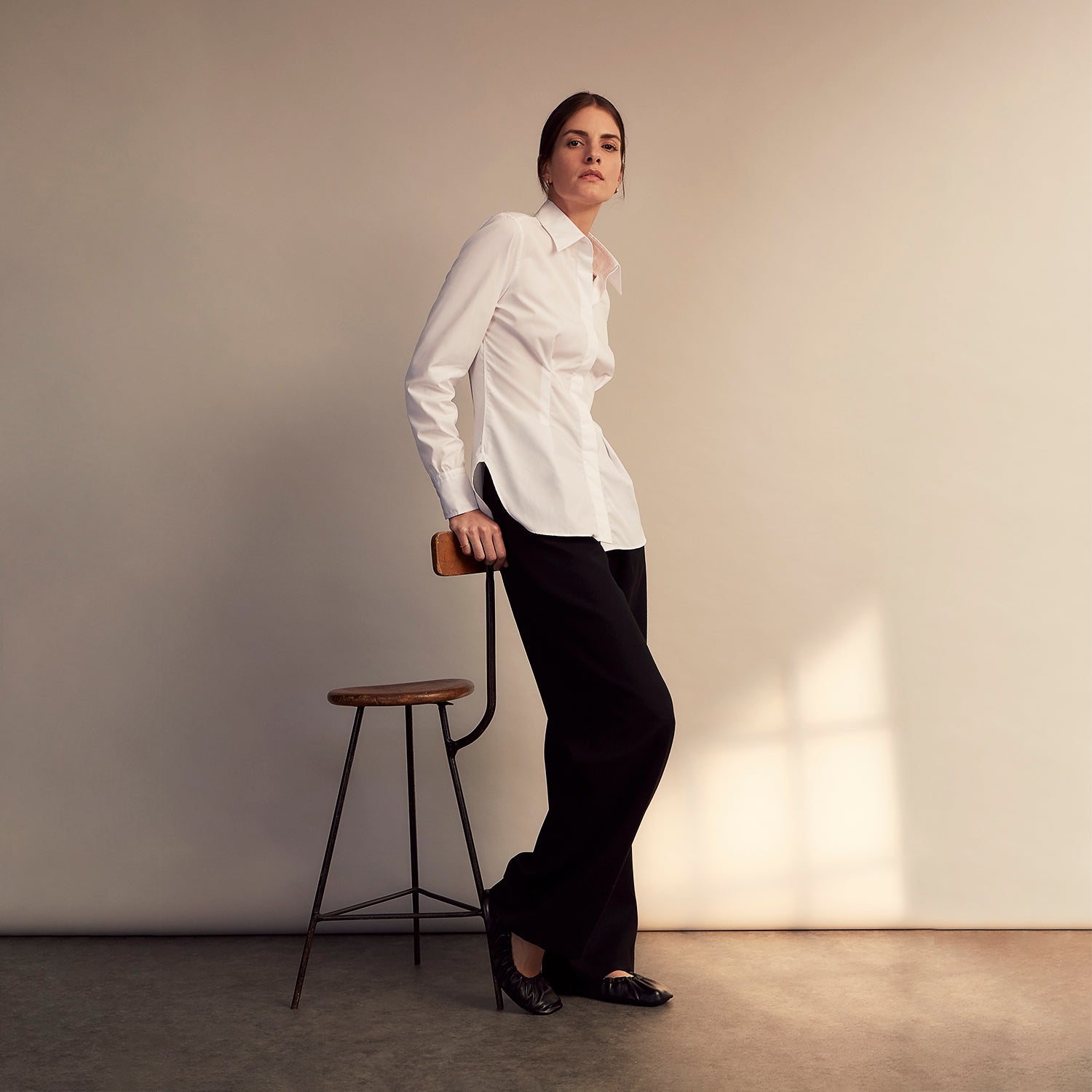 View 8 of product The White Cotton Tailored Bianca Shirt by Turnbull & Asser features a pointed collar and button cuffs, crafted from soft organic cotton and displayed flat on a white background for timeless elegance.