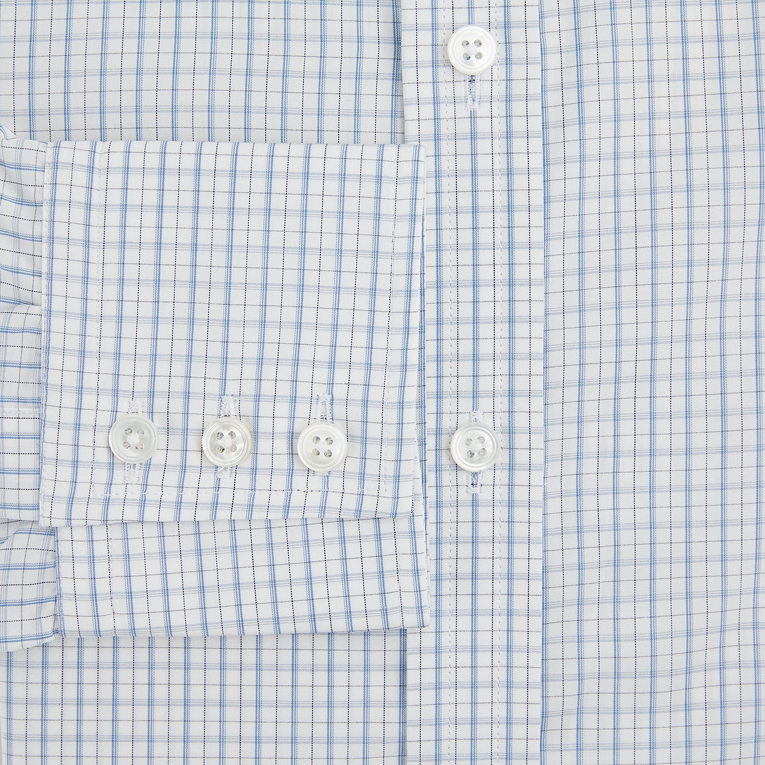 View 4 of product The Turnbull & Asser Sky Blue Combination Graph Check Mayfair Shirt features long sleeves, a pointed collar, buttoned cuffs, and a blue and white check pattern that showcases British craftsmanship. Displayed on a white background.