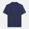 View 5 of product The Navy Silk Holiday Fit Phillips Shirt by Turnbull & Asser features short sleeves, a revere collar, and three front patch pockets, shown laid flat on a white background.