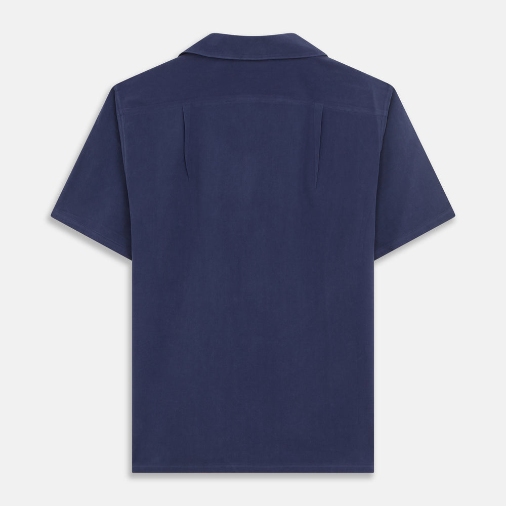 The Navy Silk Holiday Fit Phillips Shirt by Turnbull & Asser features short sleeves, a revere collar, and three front patch pockets, shown laid flat on a white background.