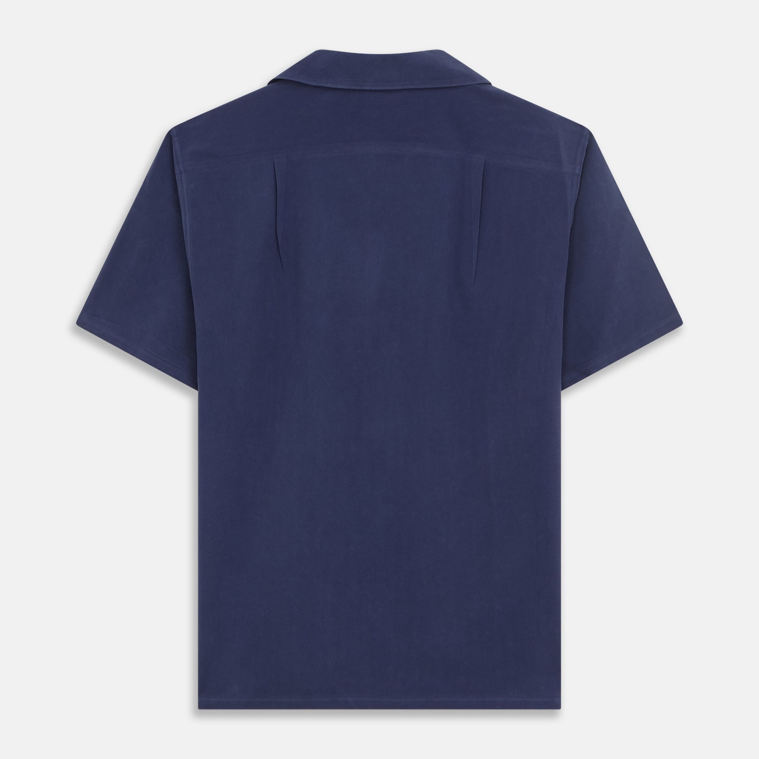View 5 of product The Navy Silk Holiday Fit Phillips Shirt by Turnbull & Asser features short sleeves, a revere collar, and three front patch pockets, shown laid flat on a white background.