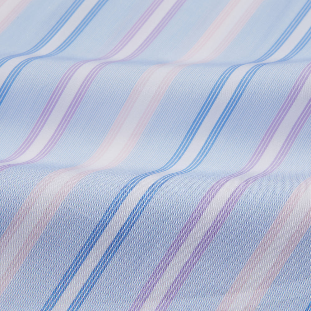 The Turnbull & Asser Light Blue Multi Stripe Cotton Regular Fit Penrose Shirt features light blue, white, and pink stripes with a crisp white collar and cuffs, displayed on a white background.