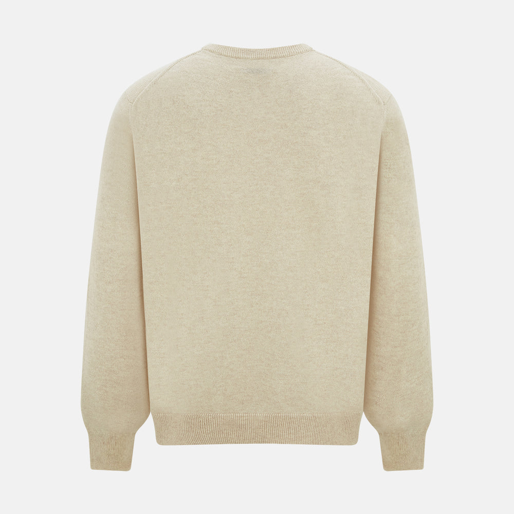 The Turnbull & Asser Cream Cashmere Round Neck Jumper features long sleeves, ribbed cuffs, and a ribbed hem—a versatile men’s knitwear staple, shown against a white background.