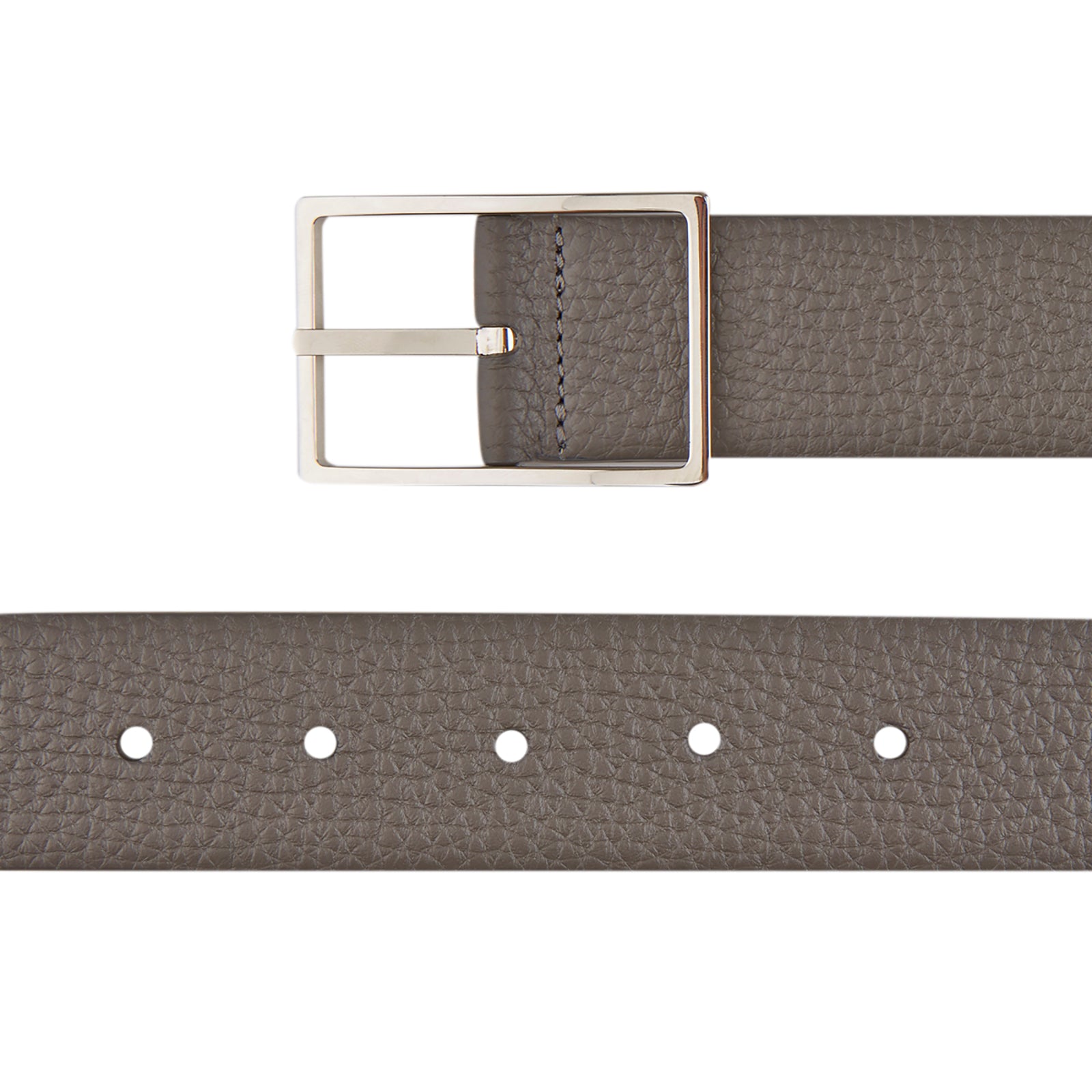 View 2 of product The Turnbull & Asser Nubuk Reversible Leather Belt is shown coiled on a plain white background, featuring gray textured leather and a rectangular silver buckle.