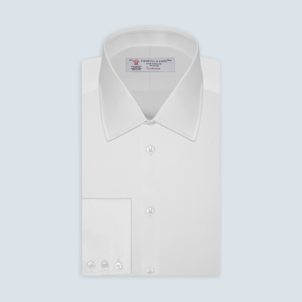 A close-up of Turnbull & Asser's White Mini Square Cotton Fabric is shown within a gray circular border on a light gray background.