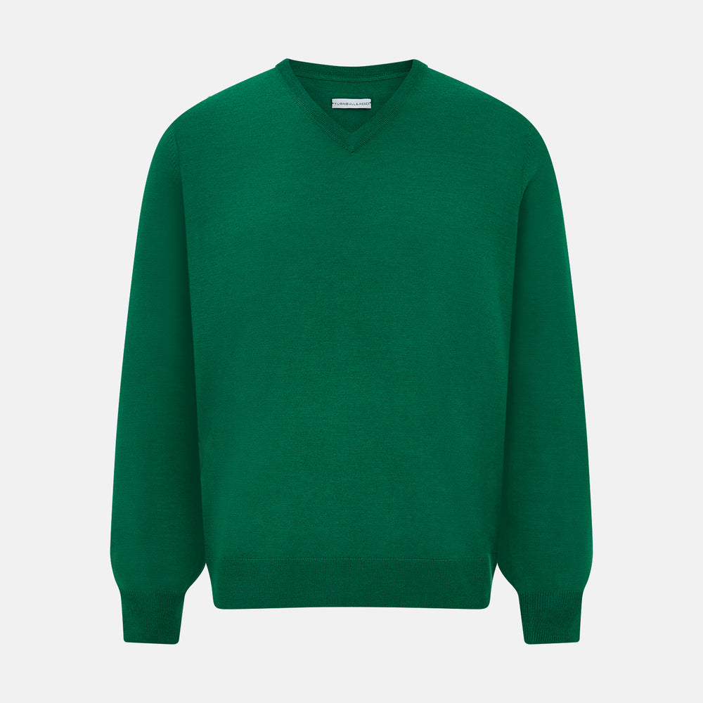 The Turnbull & Asser Hunter Green Fine Merino V-Neck Jumper is displayed against a white background, highlighting classic knitwear style.