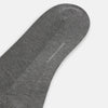 View 3 of product A single Steel Melange Micro Knit Mid-Length Sock by Turnbull & Asser, knee-high and gray, crafted from mercerised Egyptian cotton with a subtle micro knit pattern, is displayed upright on a plain white background.
