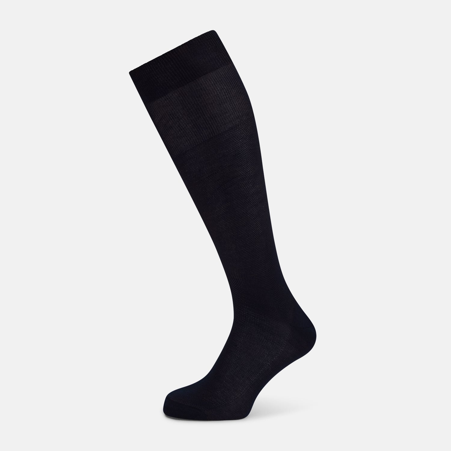 View 1 of product A single Turnbull & Asser Navy Micro Knit Long Sock is shown in a side profile against a plain white background, with the toe pointing downward and the cuff at the top.
