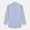 View 4 of product The Turnbull & Asser Mid-Blue Chambray Weekend Fit Shirt features a Dorset collar, white buttons, and 1-button cuffs. It is laid flat on a white background.