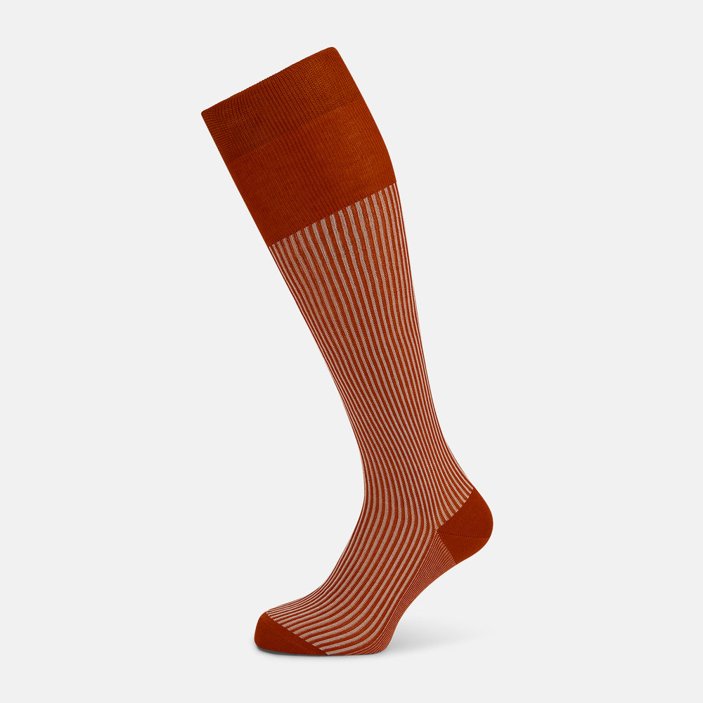 Turnbull & Asser's Rust/White Thin Striped Long Socks feature thin vertical stripes with a solid burnt orange cuff, heel, and toe. A single over-the-calf sock displayed on white background—ideal for those seeking stylish long socks.