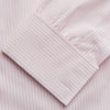 View 3 of product The Turnbull & Asser White and Pink Wide Stripe Shirt with Double Cuffs features a minimalist design, with bold vertical stripes and long sleeves, shown laid flat against a white background.