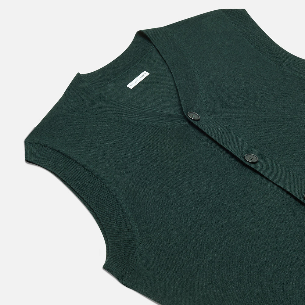 The Turnbull & Asser Petrol Green Fine Merino V-Neck Sleeveless Cardigan features two front pockets, a button-up design, and is shown against a plain white background.