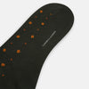 View 3 of product A single Turnbull & Asser Forest Green Patterned Mid-Length Sock with orange polka dots is displayed upright against a plain white background.