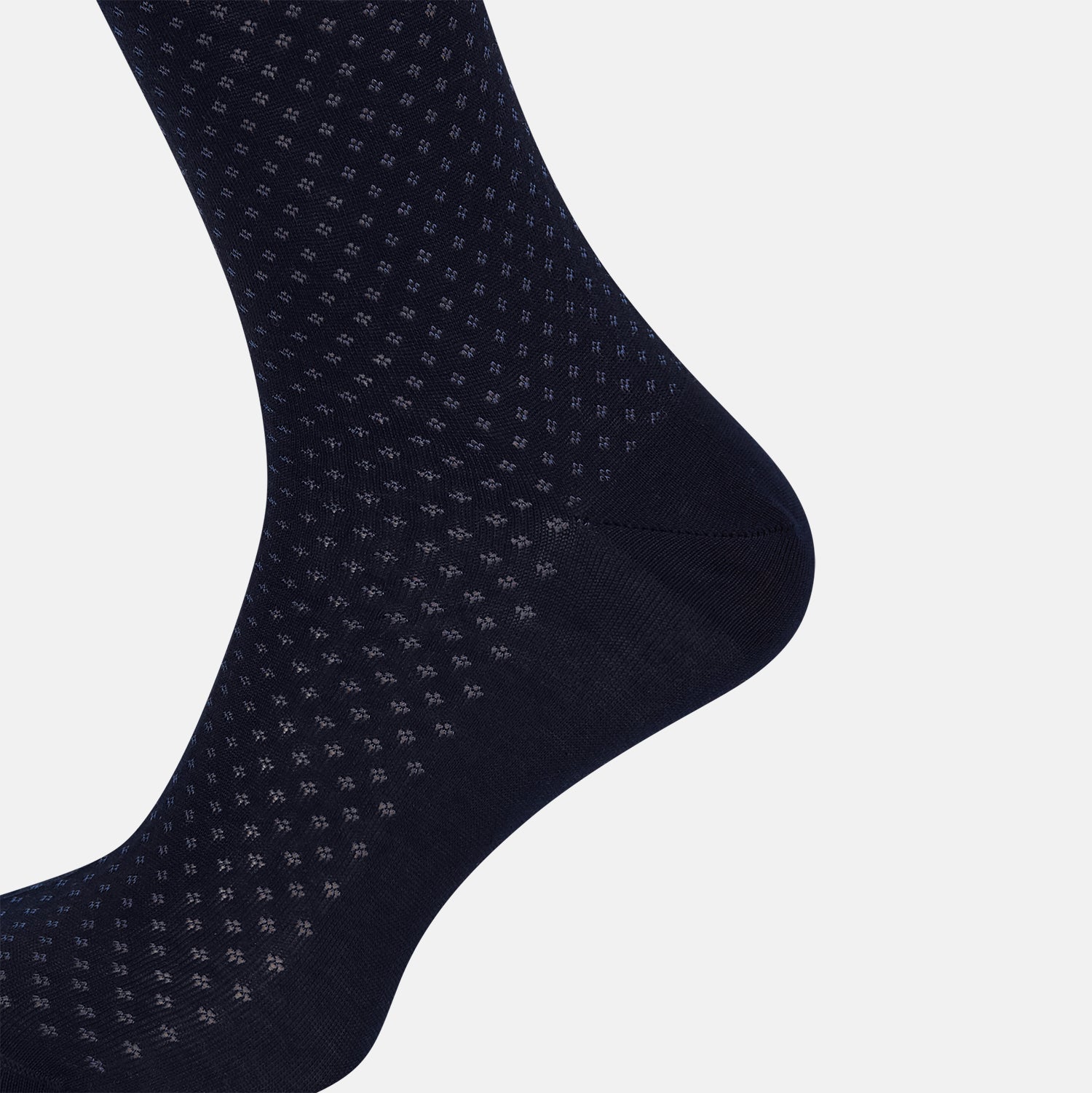 View 4 of product The Turnbull & Asser Midnight Motif Mid-Length Sock is a single black knee-high made from mercerised Egyptian cotton, featuring a subtle dotted pattern, showcased on a plain white background.