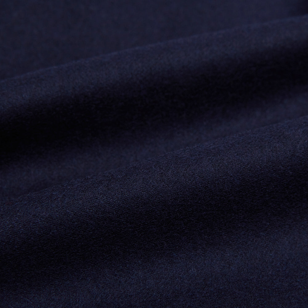 The Turnbull & Asser Midnight Blue Highbury Overshirt, featuring long sleeves, a collar, and a single chest pocket, is shown laid flat against a white background.