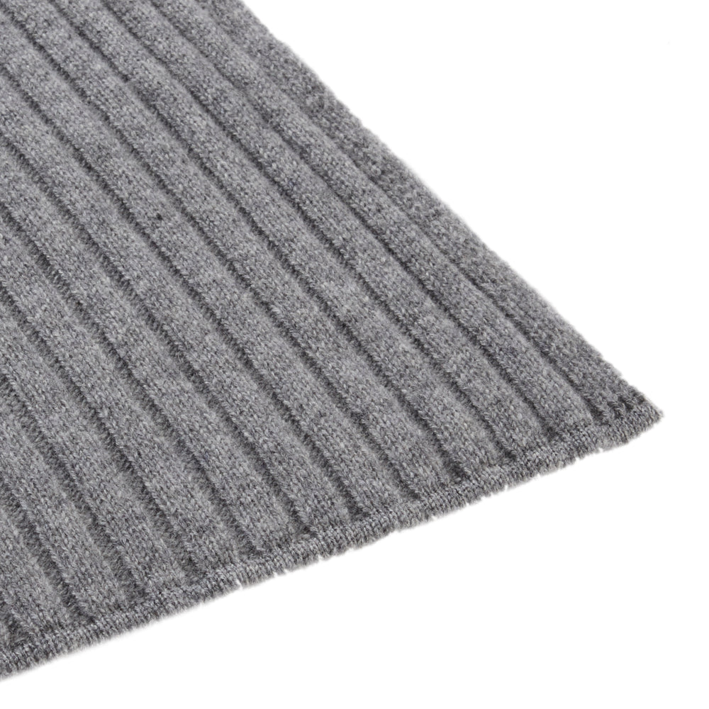 The Turnbull & Asser Grey Wool/Cashmere Scarf, featuring a ribbed design, is neatly knotted and displayed on a plain white background.