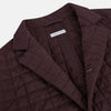 View 2 of product The Fulham Burgundy Single-Breasted Quilted Blazer by Turnbull & Asser features a grid pattern, notch lapel, three buttons, and three front pockets. Shown on a plain white background—ideal for the modern gentleman.