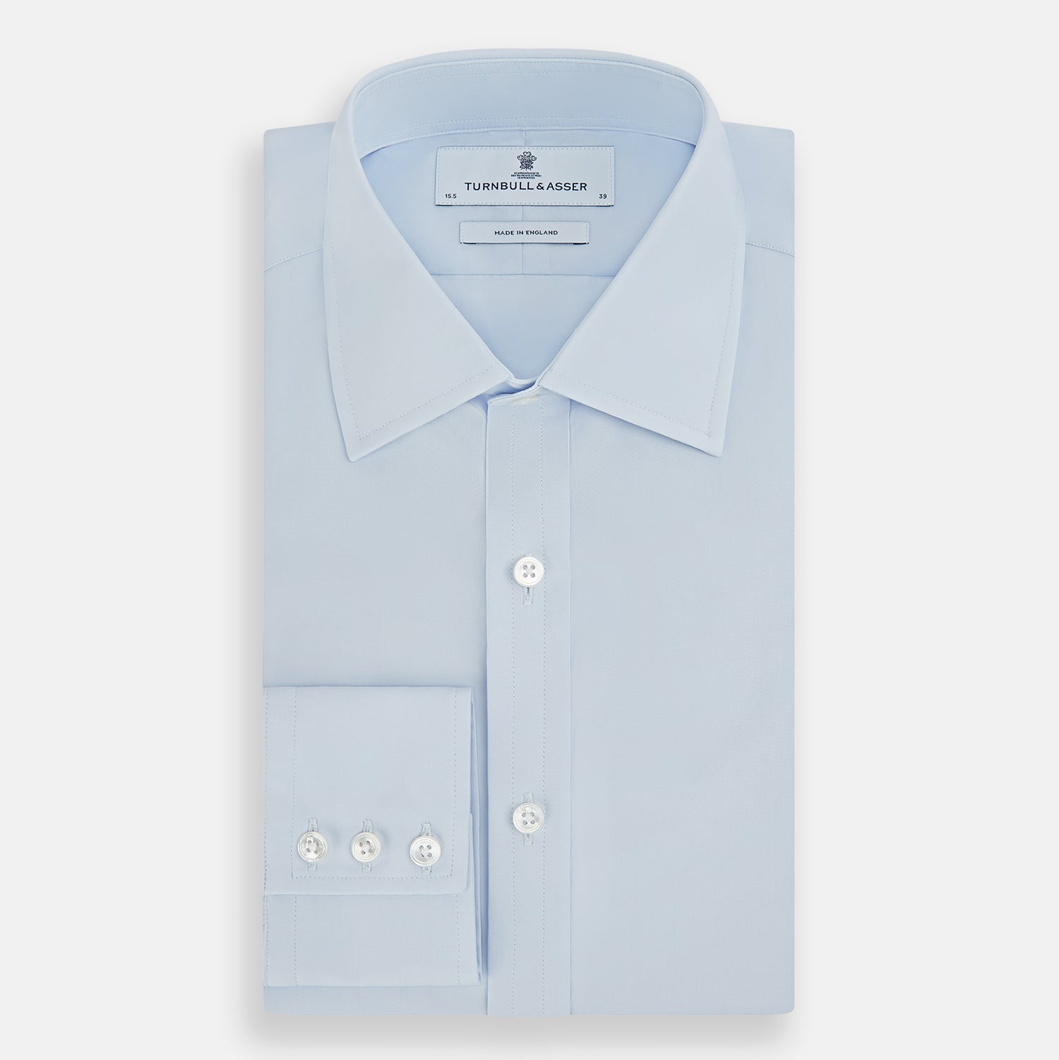 View 5 of product The Turnbull & Asser PALE BLUE COTTON REGULAR FIT MAYFAIR SHIRT is a long-sleeve, button-down shirt with a pointed T&A collar, shown laid flat on a white background.
