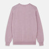 View 3 of product The Turnbull & Asser Lilac Heather Paden Cashmere V-Neck Jumper is laid flat on a white background, showcasing its light purple hue, ribbed cuffs and hem, long sleeves, and soft heathered texture.