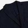 View 2 of product The Navy Knitted Oxford Blazer by Turnbull & Asser features notch lapels, two front buttons, a chest pocket, and two lower patch pockets, shown against a plain white background.