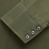 View 3 of product The Turnbull & Asser Green Silk Regular Fit Flaxton Shirt features long sleeves, a classic Bury collar, white buttons, and a straight hem, shown against a plain white background.
